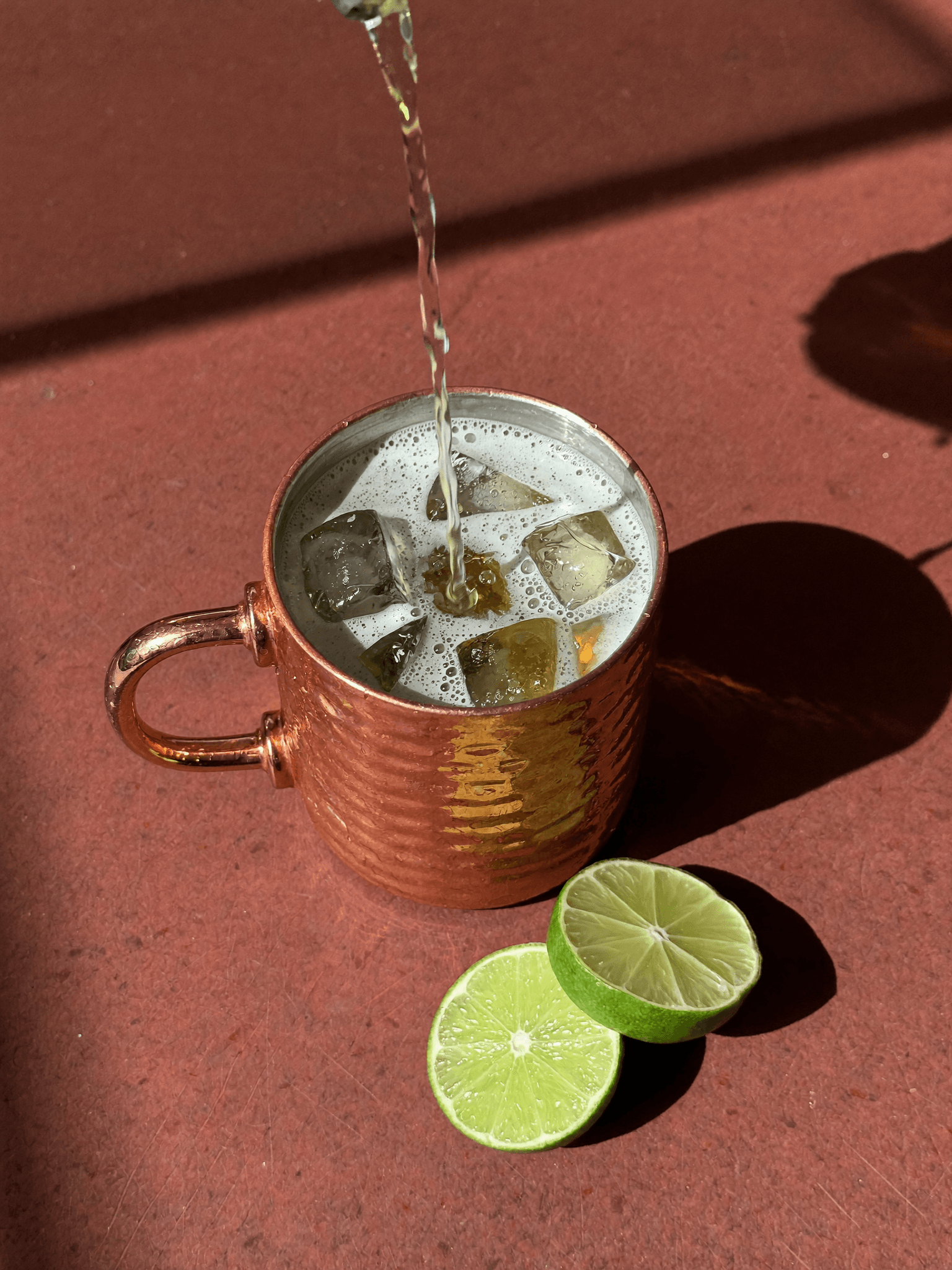 A Pombay Moscow Mule being poured, seen top-down