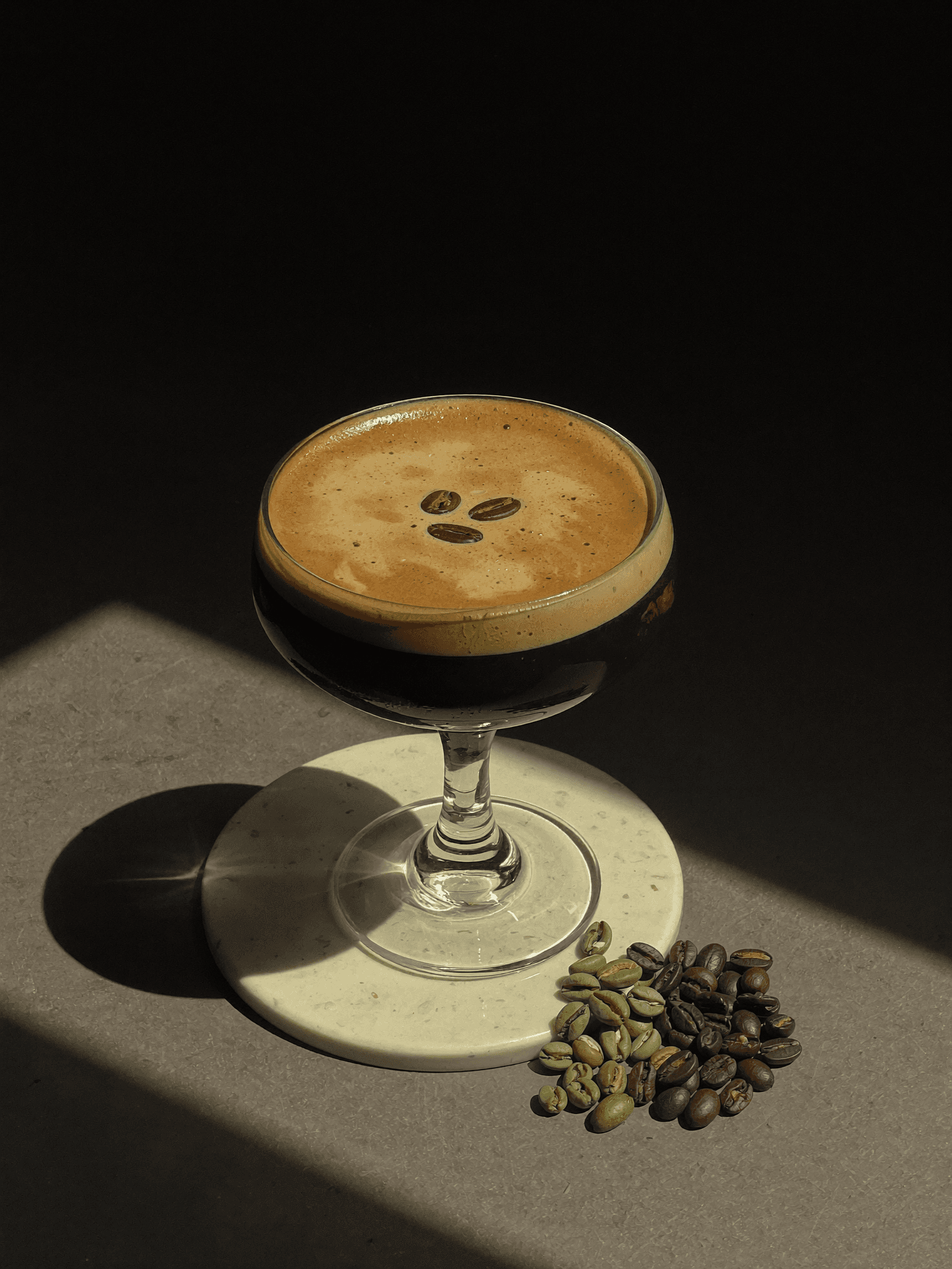 A Pombay Espresso Martini in a sunlit coupe