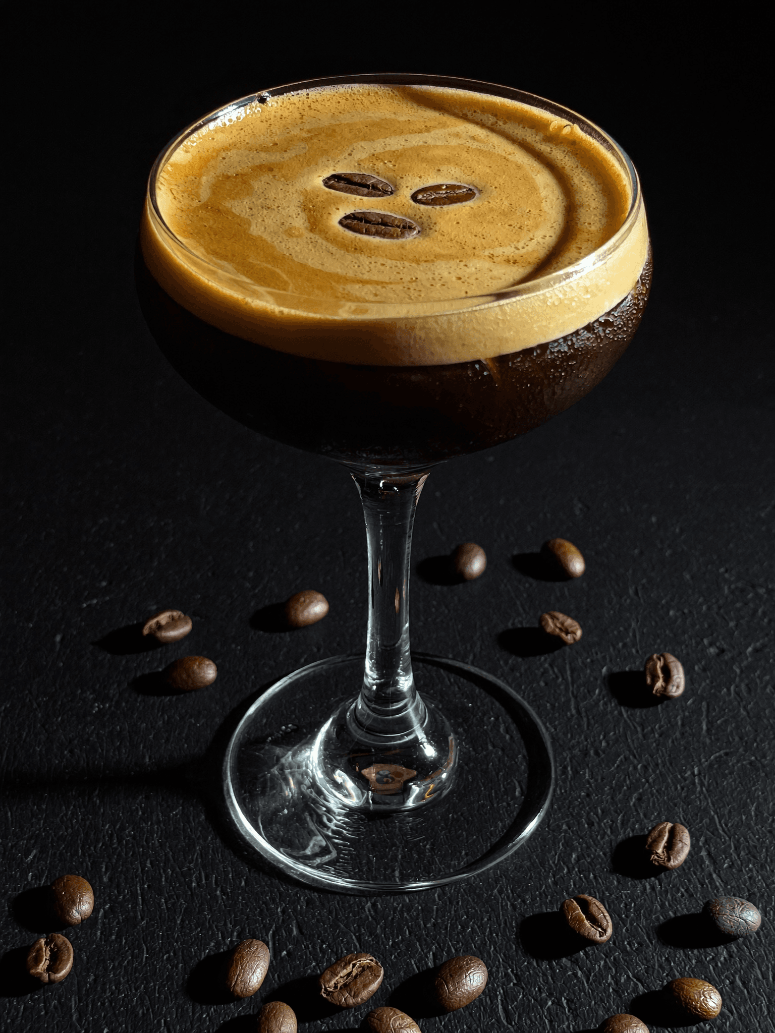 Espresso Martini made with Pombay Coffee Liqueur, topped with three coffee beans