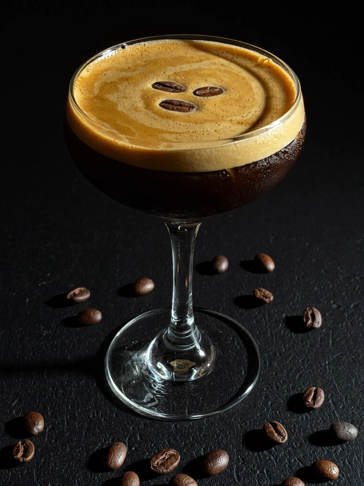 Espresso Martini made with Pombay Coffee Liqueur, topped with three coffee beans